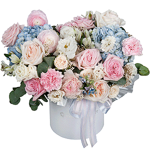 Blue/purple hydrangea - 2, Peony style roses - 3, Ranunculus Pink - 3, lisianthus - 3, Pink carnation - 7, Alstromeria white, soft pink - 11, Peony sprayrose - 2, Peony rose pink 'OHara' - 3, Round flower box medium, Oasis, Ozotamnus, Oksipetalum, Eucalyptus, Ribbon
