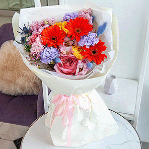 Gerbera daisies - 3, Lilac carnation - 9, Pink rose Pink X-pression 50 cm - 5, Pink Lisianthus (Eustoma) - 2, Spray rose: yellow, orange 50 cm - 2, Waxflower (1 pc.), Dried flowers in assortment, Eryngium, Eucalyptus, Wrapping Paper