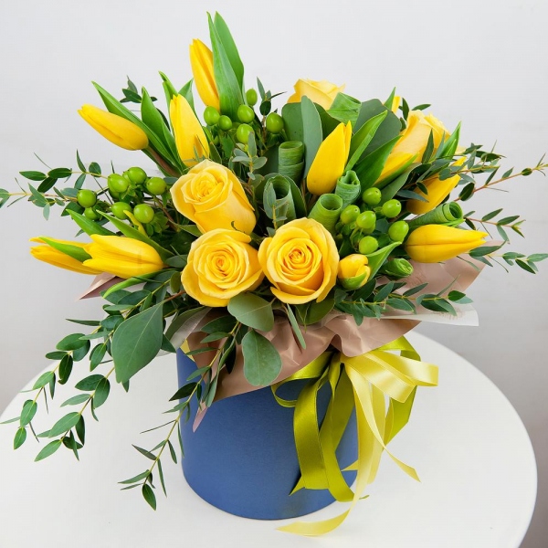 Yellow rose 50 cm - 9, Yellow tulip - 15, Round flower box small , Oasis, Wrapping Paper, Ribbon, Hypericum, Eucalyptus parvifolia (1 pc.), Eucalyptus populus (1 pc.)