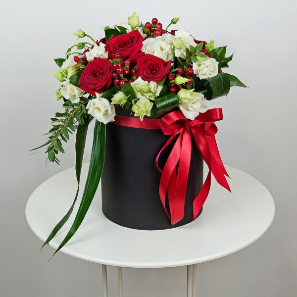 Red rose 50 cm - 15, lisianthus - 8, Round flower box medium, Oasis, Film, Ruscus, Aspidistra (1 pc.), Hypericum, Eucalyptus parvifolia (1 pc.), Ribbon