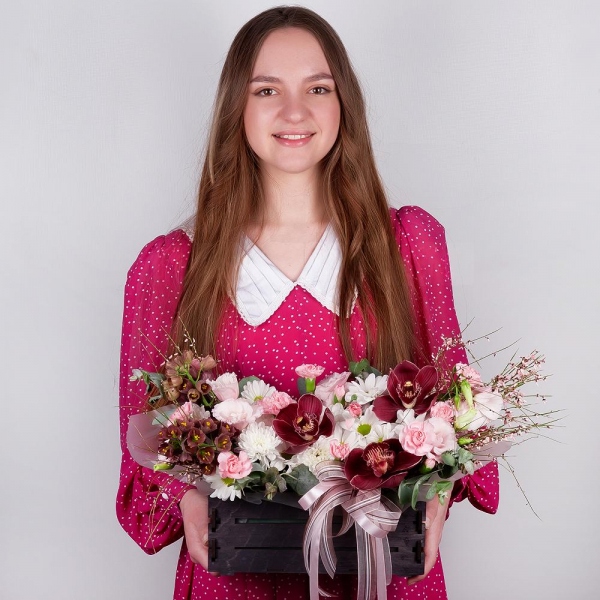 Pink Cymbidium Orchid Bud - 3, Pink Lisianthus (Eustoma) - 3, Pink spray carnation - 5, White Delphinium - 2, Bacardi White Spray Chrysanthemum - 1, Baltica White Spray Chrysanthemum - 1, Wooden pot, Oasis, Wrapping Paper, Flask for orchids, Eucalyptus, Genista