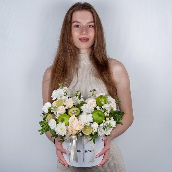 Baltica White Spray Chrysanthemum - 5, Peony sprayrose - 3, White Matthiola - 2, White spray carnation - 5, Round flower box medium, Oasis, Pistachio, Hypericum, Apple, 1 pc., Kiwi, Lemon, 1 pc., Wrapping Paper