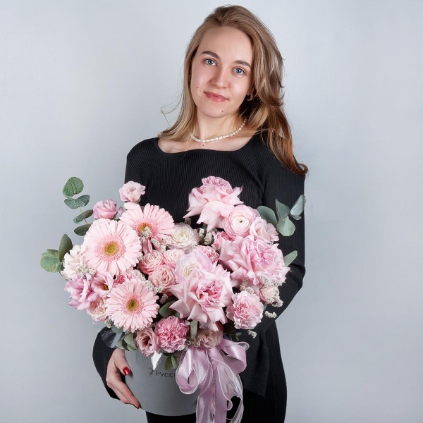 Gerbera pink - 7, Peony rose pink 'OHara' - 3, Ranunculus Pink - 3, Peony sprayrose - 3, Pink carnation - 13, Pink Lisianthus (Eustoma) - 2, Round flower box medium, Oasis, Eucalyptus, Ribbon, Limonium (1 pc.)