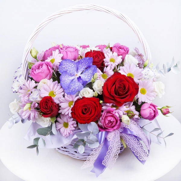 Vanda Orchid bud - 2, Bacardi Pink Spray Chrysanthemum - 4, Spray peony rose Misty Bubbles, 50 cm - 3, Purple Lisianthus (Eustoma) - 4, Red rose 50 cm - 7, Medium Basket, Oasis, Eucalyptus Cinerea, Flask for orchids, Aspidistra (1 pc.), Pistachio, Ribbon