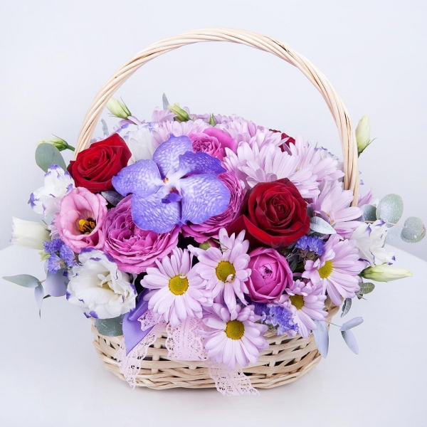 Vanda Orchid bud - 2, Bacardi Pink Spray Chrysanthemum - 3, Purple Lisianthus (Eustoma) - 2, Red rose 50 cm - 5, Spray peony rose Lavander, 50 cm - 1, Small Basket, Oasis, Flask for orchids, Pistachio, Blue Statice, Ribbon