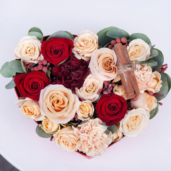 Red rose 50 cm - 3, Rose Cream 50 cm - 3, Carnation white, cream - 2, Spray rose: white, cream, light pink 50 cm - 3, Carnation red - 2, Heart‑shaped box for arrangements, Oasis, Cinnamon decorative packaging, Eucalyptus Cinerea, Brunia Green Lanuginosa (1 pc.)