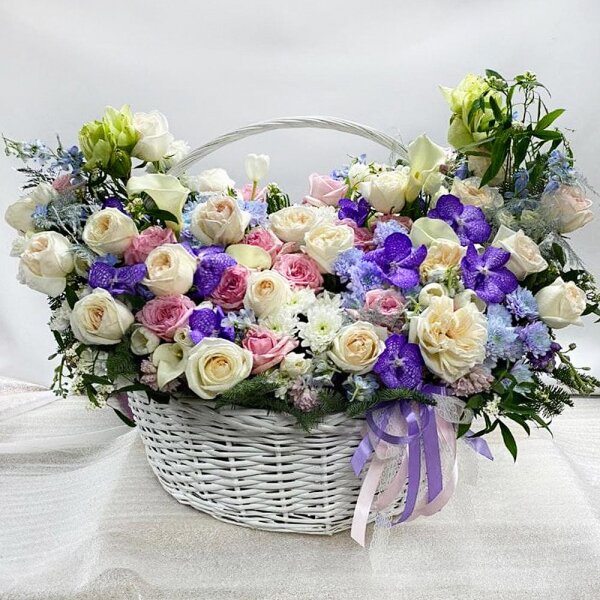 Pink Hyacinth - 15, Calla lilies - 7, Tulip white - 7, White amaryllis  - 3, Vanda Orchid bud - 23, Peony style roses - 45, Chrysanthemum spray Baltica painted blue - 11, lisianthus - 15, Matthiola Lilac - 12, Baltica White Spray Chrysanthemum - 11, Peony rose pink 'OHara' - 45, Huge basket, Oasis, Asparagus setaceus (1 pc.), Waxflower (1 pc.), Blue Delphinium, Flask for orchids, Fern (1 pc.), Spruce branches (1pc.), Ribbon