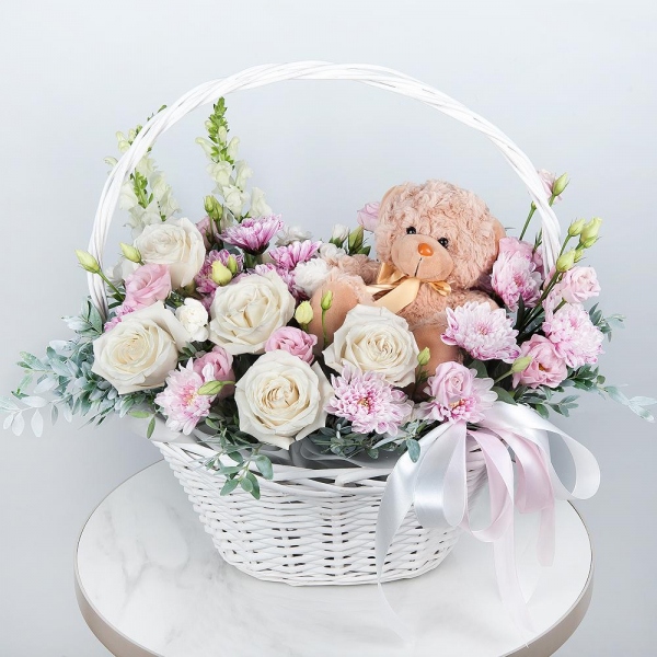 White Matthiola - 2, White rose 50 cm - 9, Baltica Pink Spray Chrysanthemum - 3, White spray carnation - 4, Pink Lisianthus (Eustoma) - 3, Medium Basket, Oasis, Pistachio, Teddy bear 20 cm, Ribbon