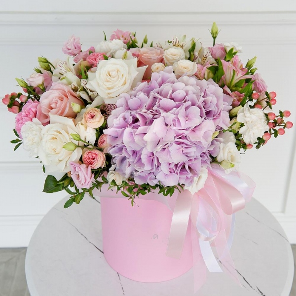 Pink Hydrangea - 1, White rose 50 cm - 4, Pink rose 50 cm - 4, Peony sprayrose - 2, Pink Lisianthus (Eustoma) - 1, Pink carnation - 8, White spray carnation - 4, Alstromeria white, soft pink - 5, Spray rose: white, cream, light pink 50 cm - 2, lisianthus - 1, Round flower box medium, Oasis, Ribbon, Ozotamnus, Hypericum, Pistachio