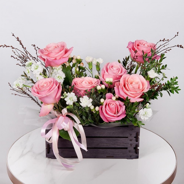 Pink rose 50 cm - 11, White Matthiola - 1, White spray carnation - 4, Wooden pot, Oasis, Wrapping Paper, Pistachio, Hypericum, Artificial branch