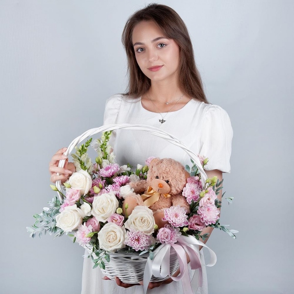 White Matthiola - 2, White rose 50 cm - 9, Baltica Pink Spray Chrysanthemum - 3, White spray carnation - 4, Pink Lisianthus (Eustoma) - 3, Medium Basket, Oasis, Pistachio, Teddy bear 20 cm, Ribbon
