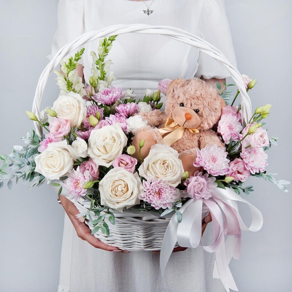 White Matthiola - 2, White rose 50 cm - 9, Baltica Pink Spray Chrysanthemum - 3, White spray carnation - 4, Pink Lisianthus (Eustoma) - 3, Medium Basket, Oasis, Pistachio, Teddy bear 20 cm, Ribbon