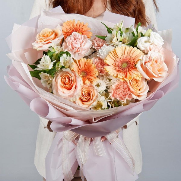 Cream gerbera - 3, Baltica White Spray Chrysanthemum - 2, Carnation white, cream - 11, Pink-orange rose Phoenix 50 cm - 5, Alstromeria white, soft pink - 3, lisianthus - 2, Wrapping Paper