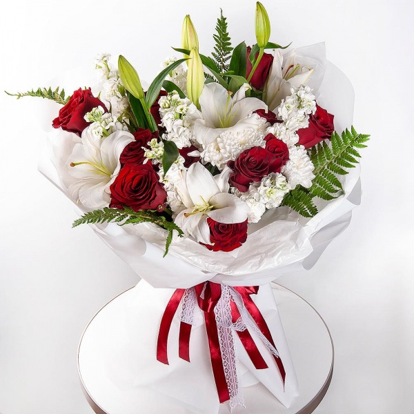 Rose Red 50 cm Ecuador - 17, Baltica White Spray Chrysanthemum - 2, White Matthiola - 7, Lilies - 2, Fern (1 pc.), Wrapping Paper