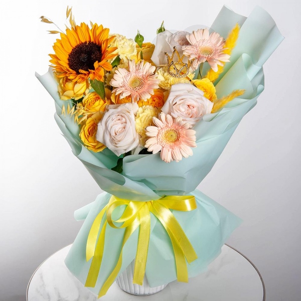 Sunflower - 1, Cream gerbera - 7, Spray rose: yellow, orange 50 cm - 3, Yellow carnation - 10, Peony style roses - 3, Dried flowers in assortment, Decorative crown, Wrapping Paper