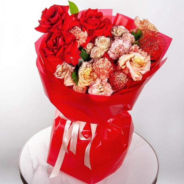 Red rose Nina 50 cm - 5, Cream Rose 50 cm Ecuador (Creme Caramel) - 4, Carnation white, cream - 3, Pink Lisianthus (Eustoma) - 2, Spray rose: white, cream, light pink 50 cm - 2,  Raspberry branch, Wrapping Paper, Nutan