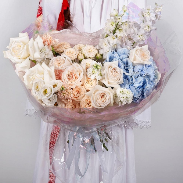 White rose 50 cm Ecuador - 2, Blue/purple hydrangea - 1, Spray peony rose  - 5, Carnation white, cream - 12, White Matthiola - 4, Baltica White Spray Chrysanthemum - 1, lisianthus - 1, Blue Delphinium, Wrapping Paper