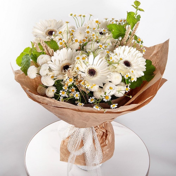 Gerbera white - 11, Chamomile - 4, Newton White Spray Chrysanthemum - 5, Dried flowers in assortment,  Raspberry branch, Wrapping Paper
