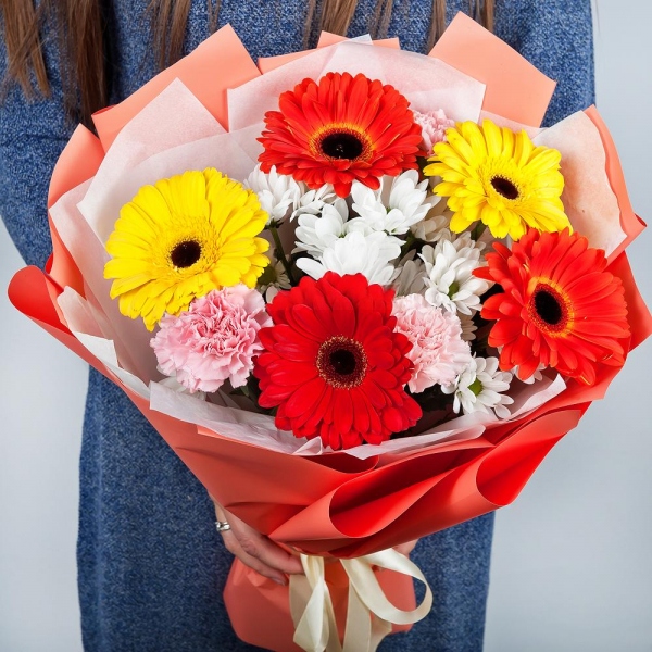 Gerbera daisies - 2, Bacardi White Spray Chrysanthemum - 3, Pink carnation - 4, Gerbera yellow - 3, Gerbera red - 2, Wrapping Paper, Ribbon