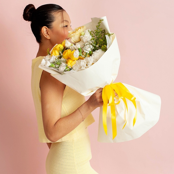 Spray rose: yellow, orange 50 cm - 2, lisianthus - 3, Carnation white, cream - 7, White spray carnation - 7, Rose Yellow 50 cm Ecuador (Mohana, Latina, Brighton) - 1, Solidago (1 pc.), Limonium (1 pc.), Wrapping Paper