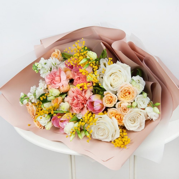 Spray rose: white, cream, light pink 50 cm - 3, White rose 50 cm - 4, Pink carnation - 4, lisianthus - 2, Pink tulip - 4, Mimosa - 2, White Matthiola - 3, Wrapping Paper