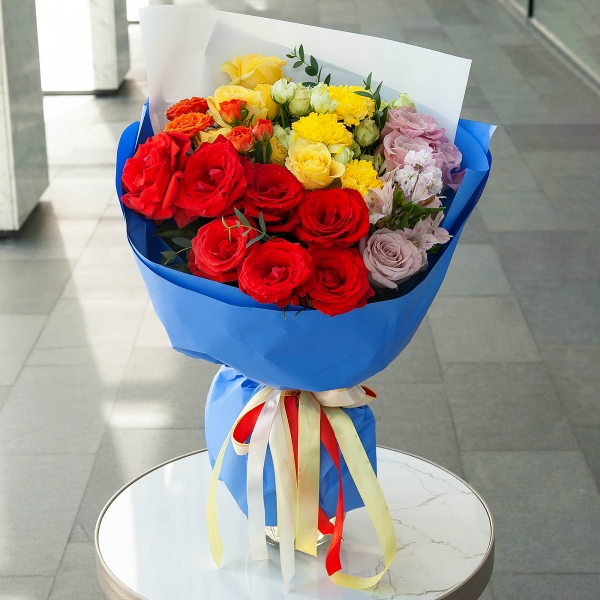 Red rose Nina 50 cm - 9, Spray rose: yellow, orange 50 cm - 2, Bright pink spray rose mix, 50 cm - 5, Rose Pink 50 cm Ecuador (Chelo, Hermosa, Novia, Titanik, Engagement, Pink Mondiale) - 4, Yellow carnation - 5, Pink Matthiola - 1, Alstromeria lilac, purple - 2, Eucalyptus parvifolia (1 pc.), Wrapping Paper