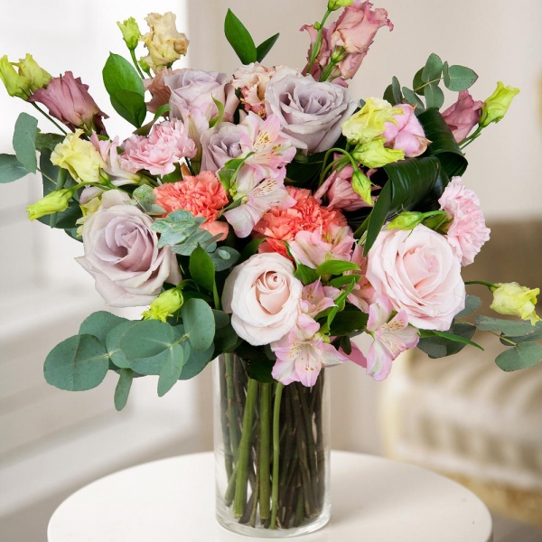 Orange carnation - 3, Pink rose 50 cm - 8, Alstromeria white, soft pink - 3, Pink Lisianthus (Eustoma) - 4, Pink carnation - 3, Ruscus, Aspidistra (1 pc.), Eucalyptus Cinerea, Wrapping Paper