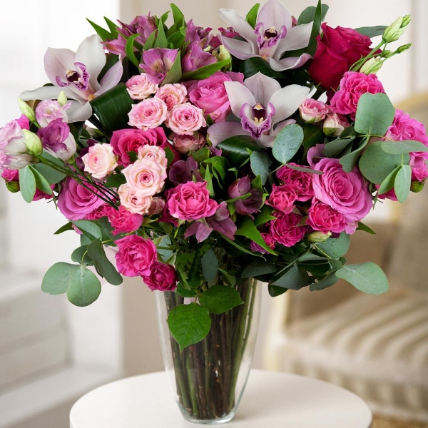 Pink rose 50 cm - 8, Pink Lisianthus (Eustoma) - 4, Alstromeria Red, Bright Pink - 3, Bright pink spray rose mix, 50 cm - 10, White Cymbidium Orchid Bud - 4, Eucalyptus Cinerea, Flask for orchids, Aspidistra (1 pc.), Wrapping Paper