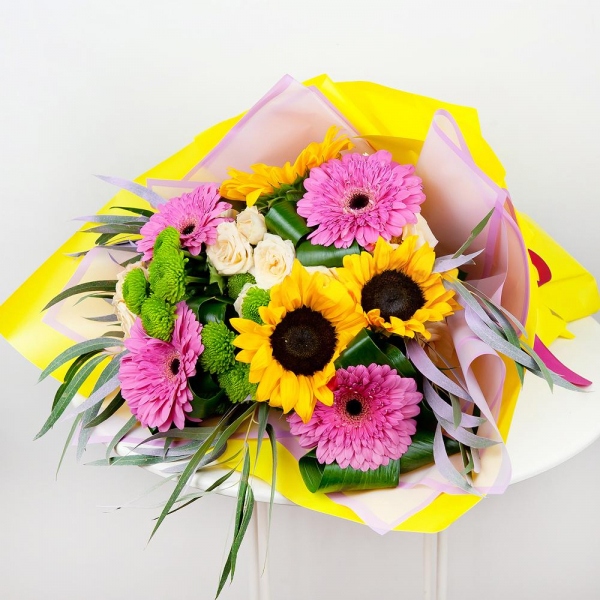 Sunflower - 5, Gerbera pink - 5, Athos pom Feeling Green - 3, Spray rose: white, cream, light pink 50 cm - 3, Aspidistra (1 pc.), Eucalyptus, Wrapping Paper