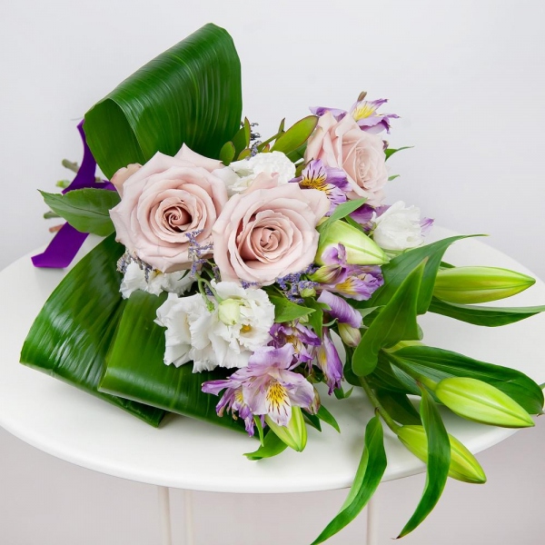 Lilies - 2, lisianthus - 3, Alstromeria lilac, purple - 3, Rose Powder 50 cm Ecuador (Quicksand, Menta) - 5, Limonium (1 pc.), Aspidistra (1 pc.), Ribbon
