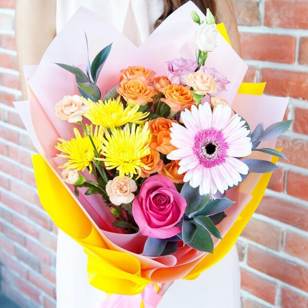 Spray rose: yellow, orange 50 cm - 2, Pink spray carnation - 2, Baltica Yellow Spray Chrysanthemum - 2, Pink Lisianthus (Eustoma) - 1, Gerbera pink - 1, Pink rose 50 cm - 3, Ruscus, Wrapping Paper