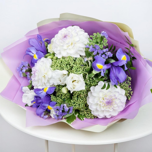 White Dahlia - 5, lisianthus - 2, Irises - 5, Sedum, Pittosporum, Pistachio, Wrapping Paper, Blue Statice