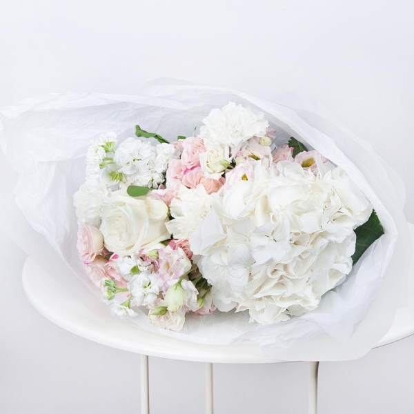  White Hydrangea - 1, Carnation white, cream - 3, Pink Lisianthus (Eustoma) - 3, White rose 50 cm - 3, White Matthiola - 3, Spray rose: white, cream, light pink 50 cm - 2, Wrapping Paper