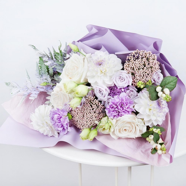 White rose 50 cm - 5, White Dahlia - 4, Lilac carnation - 5, Spray rose: white, cream, light pink 50 cm - 4, lisianthus - 4, Ozotamnus, Fern (1 pc.), Symphoricarpos, Wrapping Paper