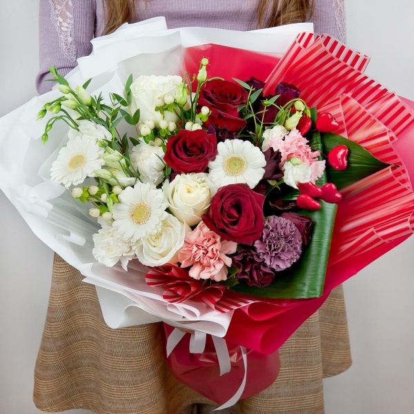 Gerbera white - 5, lisianthus - 5, Red rose 50 cm - 5, White rose 50 cm - 4, Lilac carnation - 1, Spray rose: red 50 cm - 5, Carnation white, cream - 3, Pink carnation - 3, Hypericum, Eucalyptus parvifolia (1 pc.), Aspidistra (1 pc.), Decorative element small, Wrapping Paper