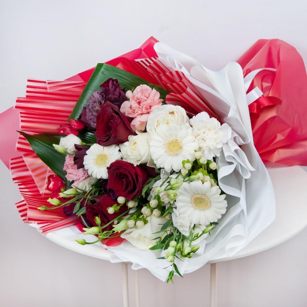 Gerbera white - 5, lisianthus - 5, Red rose 50 cm - 5, White rose 50 cm - 4, Lilac carnation - 1, Spray rose: red 50 cm - 5, Carnation white, cream - 3, Pink carnation - 3, Hypericum, Eucalyptus parvifolia (1 pc.), Aspidistra (1 pc.), Decorative element small, Wrapping Paper