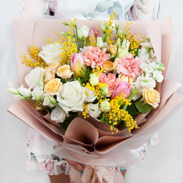 Spray rose: white, cream, light pink 50 cm - 4, White rose 50 cm - 5, Pink carnation - 4, lisianthus - 3, Pink tulip - 5, Mimosa - 2, White Matthiola - 3, Wrapping Paper