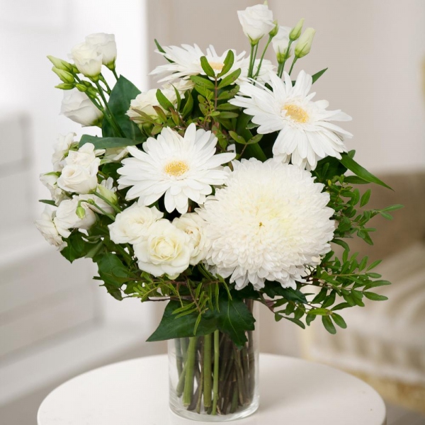 Magnum White Chrysanthemum - 3, Gerbera white - 4, lisianthus - 3, Spray rose: white, cream, light pink 50 cm - 5, Pistachio, Aspidistra (1 pc.), Wrapping Paper