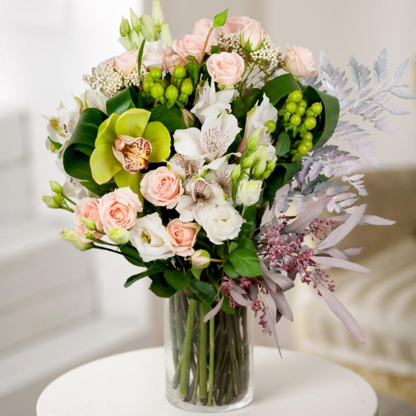 Spray rose: white, cream, light pink 50 cm - 6, lisianthus - 3, Green Cymbidium Orchid Bud - 3, Alstromeria white, soft pink - 4, Hypericum, Ozotamnus, Aspidistra (1 pc.), Flask for orchids, Fern (1 pc.), Eucalyptus populus (1 pc.), Wrapping Paper