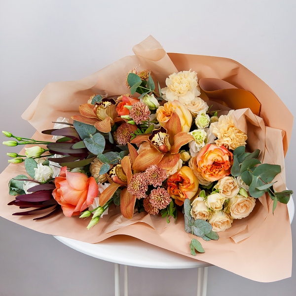 Orchid bud yellow/brown Cymbidium - 3, Athos poms Stallion - 3, Spray rose: white, cream, light pink 50 cm - 3, lisianthus - 2, Carnation white, cream - 5, Pink-orange rose Phoenix 50 cm - 7, Flask for orchids, Leukodendron, Eucalyptus Cinerea, Pistachio, Wrapping Paper