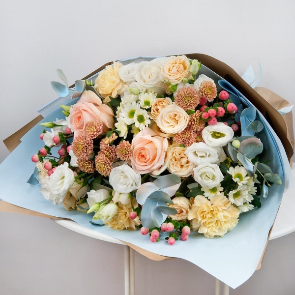 White rose 50 cm - 2, Rose Cream 50 cm - 3, Spray rose: white, cream, light pink 50 cm - 3, lisianthus - 4, Carnation white, cream - 4, Daisy poms Santini pink, purple - 3, Santini White Spray Chrysanthemum - 3, Hypericum, Eucalyptus Cinerea, Wrapping Paper