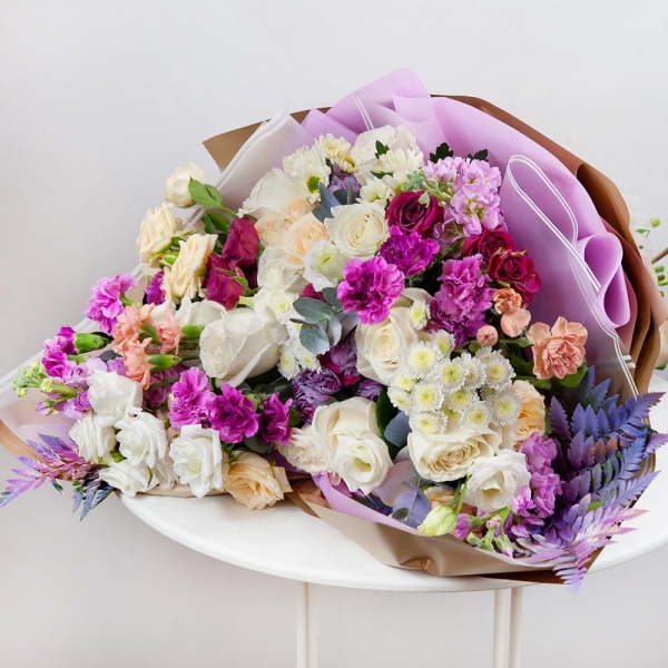 White rose 50 cm - 15, Pink spray carnation - 12, lisianthus - 4, Athos poms Stallion - 2, Santini White Spray Chrysanthemum - 3, Spray rose: white, cream, light pink 50 cm - 11, Pink Matthiola - 3, Pistachio, Fern (1 pc.), Wrapping Paper