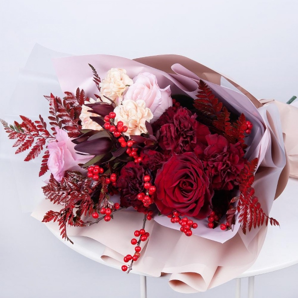 Red rose 50 cm - 2, Pink rose 50 cm - 3, Carnation red - 7, Carnation white, cream - 5, Fern (1 pc.), Ilex, Leukodendron, Wrapping Paper, Ribbon