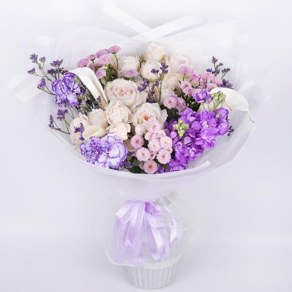 Peony style roses - 7, Calla lilies - 3, Carnation white, cream - 5, Peony sprayrose - 2, Matthiola Lilac - 2, Daisy poms Santini pink, purple - 4, Limonium (1 pc.), Wrapping Paper, Ribbon