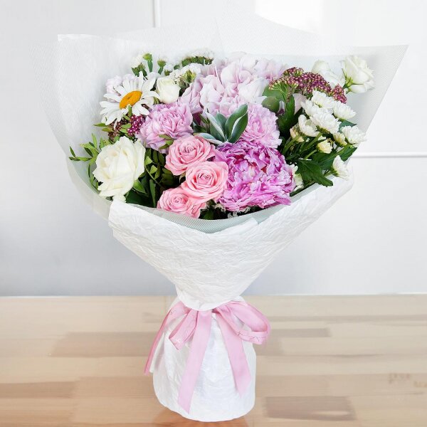 Bright pink spray rose mix, 50 cm - 1, Pink Matthiola - 2, White rose 50 cm - 1, lisianthus - 1, Santini White Spray Chrysanthemum - 2, Pink Hydrangea - 1, Pink carnation - 3, Chamomile - 1, Peony pink - 1, White statice, Ozotamnus, Ruscus, Pistachio, Wrapping Paper