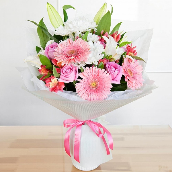 Lilies - 2, Alstromeria Red, Bright Pink - 3, Gerbera pink - 3, Pink rose 50 cm - 7, Bacardi White Spray Chrysanthemum - 3, Pistachio, Ruscus, Wrapping Paper, Ribbon