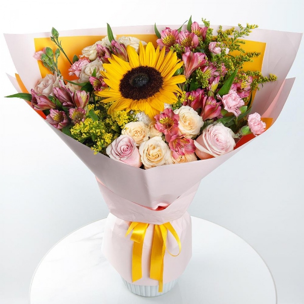 Sunflower - 1, Spray rose: white, cream, light pink 50 cm - 2, Pink rose 50 cm - 4, Pink spray carnation - 4, Alstromeria Red, Bright Pink - 6, Baltica White Spray Chrysanthemum - 1, Solidago (1 pc.), Wrapping Paper