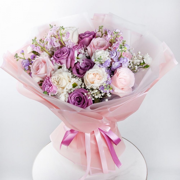 Bacardi White Spray Chrysanthemum - 3, Gypsophila - 2, Matthiola Lilac - 4, Pink rose 50 cm - 6, Moody Blue Rose - 4, Peony style roses - 3, Pink carnation - 4, White spray carnation - 3, Wrapping Paper