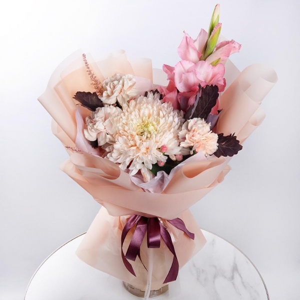 Pink Gladiolus - 1, Magnum White Chrysanthemum - 1, Carnation white, cream - 5, Hypericum, Astilbe, Salal, Wrapping Paper
