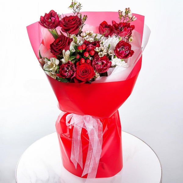 Baltica White Spray Chrysanthemum - 1, Red rose 50 cm - 3, Red tulip - 9, Alstromeria white, soft pink - 3, Hypericum, Waxflower (1 pc.), Wrapping Paper